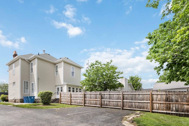 424 S 4th St, Danville, KY 40422 - view of side of home with fence, a chimney, and uncovered parking