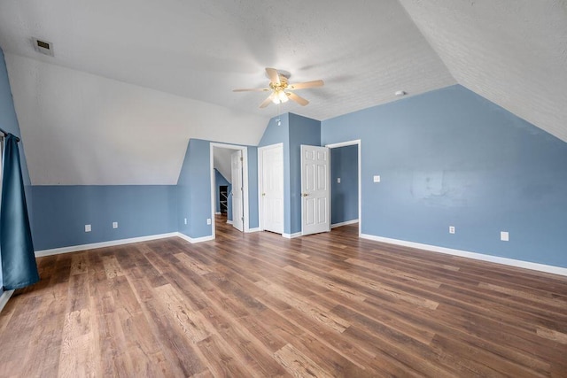 bonus room with a ceiling fan, baseboards, visible vents, and wood finished floors