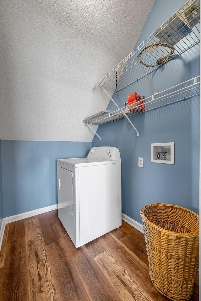 laundry room featuring washer / dryer, laundry area, baseboards, and wood finished floors