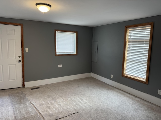 unfurnished room with carpet flooring