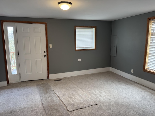 entrance foyer with carpet