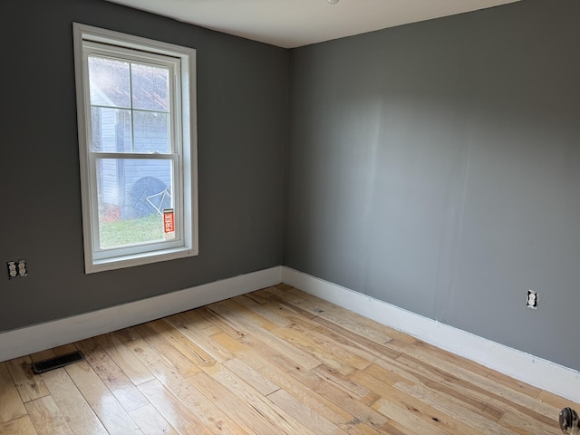 unfurnished room featuring light hardwood / wood-style flooring