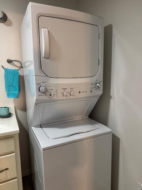 430 Lost Lodge Rd, Somerset, KY 42501 - clothes washing area with cabinet space and stacked washer and clothes dryer