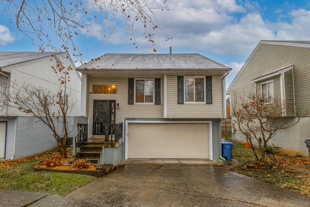 split foyer home featuring a garage