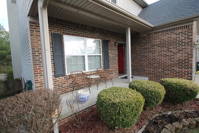 doorway to property with a porch