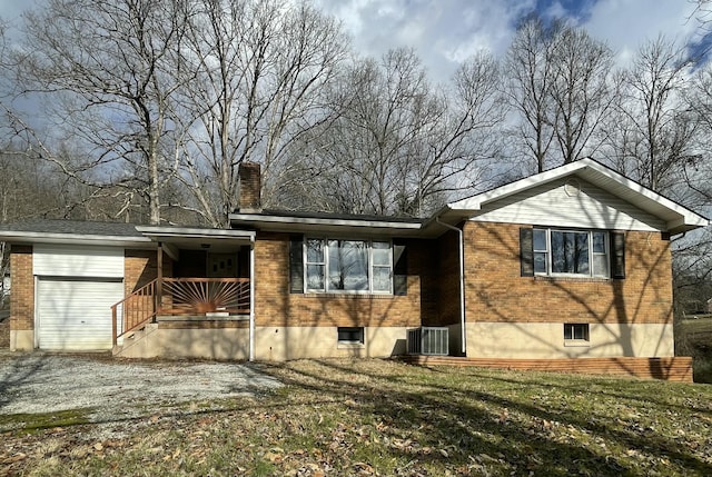 exterior space featuring a garage and cooling unit