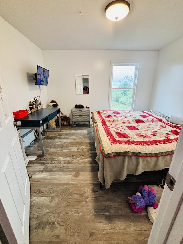 bedroom with wood-type flooring