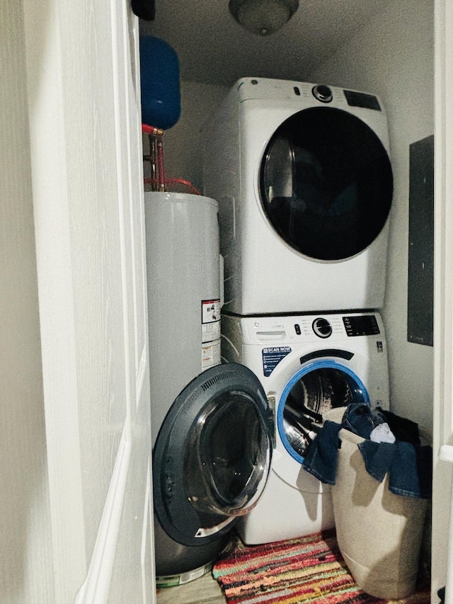 laundry room with stacked washer and clothes dryer