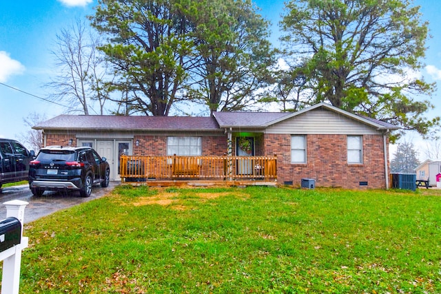 ranch-style home featuring cooling unit and a front yard