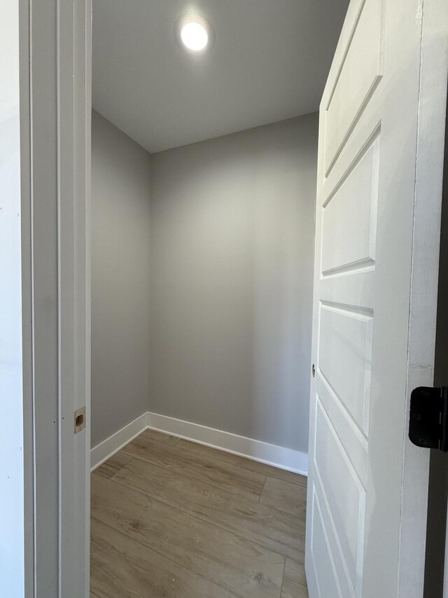 unfurnished room with ceiling fan and light wood-type flooring