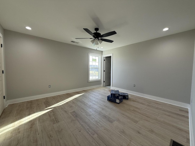 spare room featuring ceiling fan and light hardwood / wood-style floors