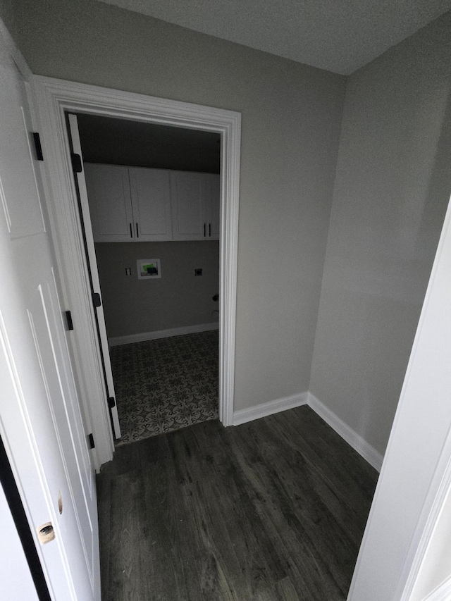 corridor featuring dark hardwood / wood-style flooring