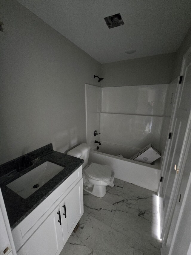 full bathroom with  shower combination, toilet, and vanity