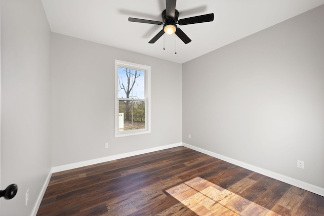 spare room featuring dark hardwood / wood-style floors and ceiling fan