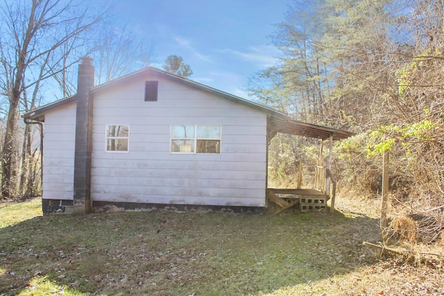 view of home's exterior with a yard