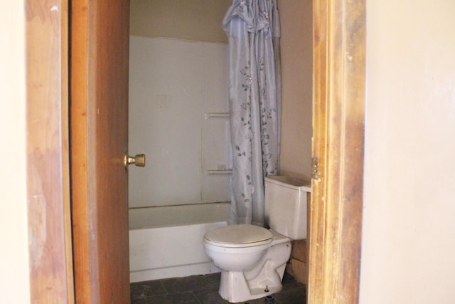 bathroom with tile patterned flooring, toilet, and shower / tub combo with curtain