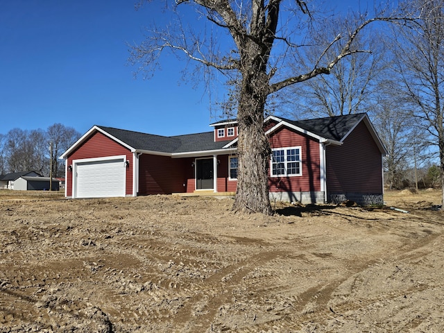 single story home featuring an attached garage