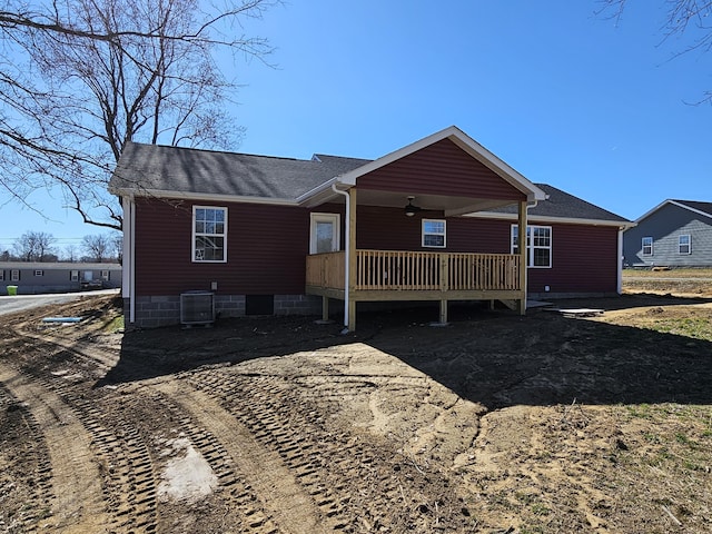 view of front of home featuring central AC unit and a ceiling fan