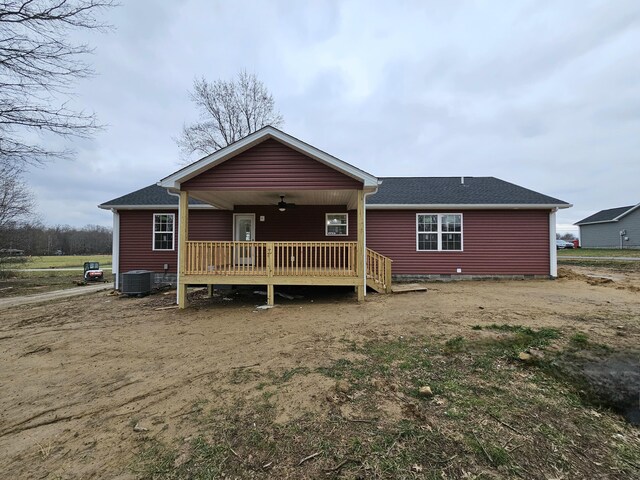 back of house featuring ceiling fan, cooling unit, and a deck