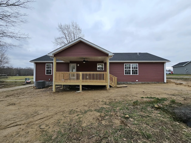 rear view of house featuring ceiling fan and central AC