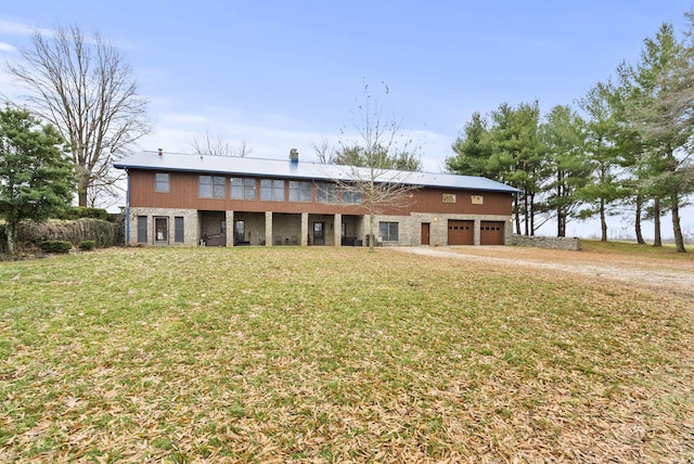 back of house featuring a yard