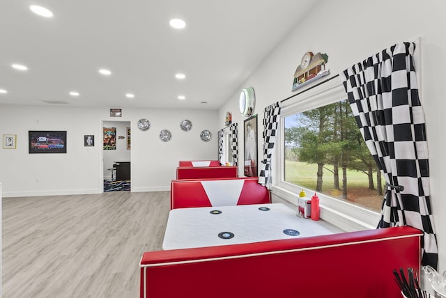 recreation room featuring light hardwood / wood-style floors