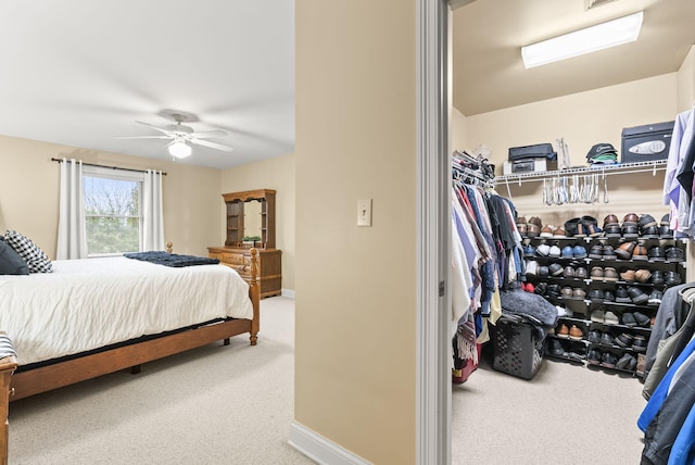 bedroom featuring ceiling fan and carpet floors