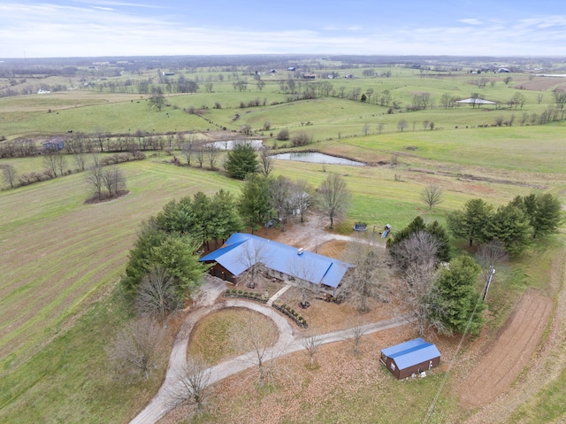 birds eye view of property featuring a rural view and a water view