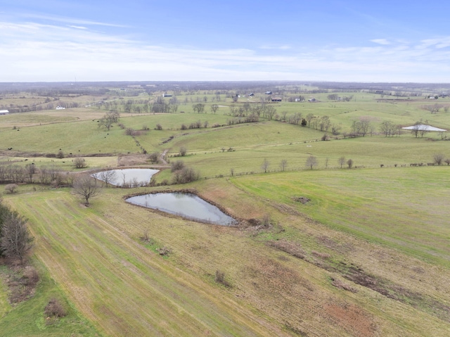 bird's eye view with a rural view and a water view