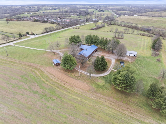 birds eye view of property with a rural view