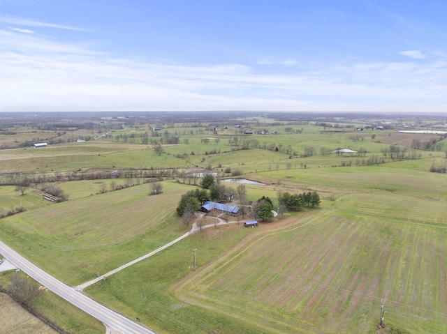 birds eye view of property with a rural view