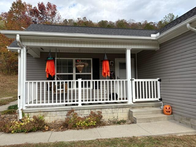 property entrance with covered porch