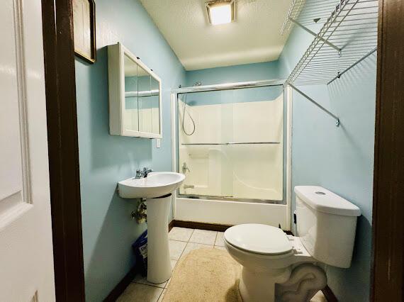 bathroom featuring tile patterned floors and toilet