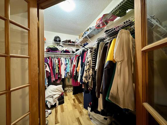 walk in closet featuring light hardwood / wood-style floors