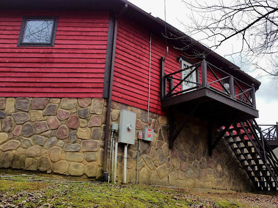 view of home's exterior with a balcony