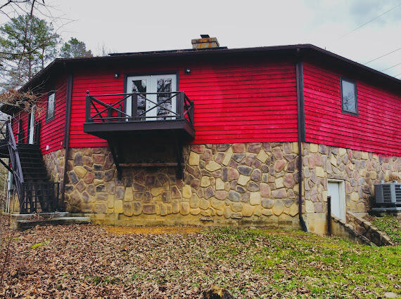 view of property exterior featuring a balcony and central air condition unit