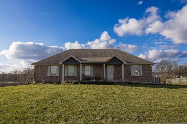 ranch-style home with a front lawn