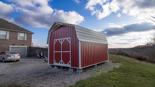 view of outbuilding with a yard