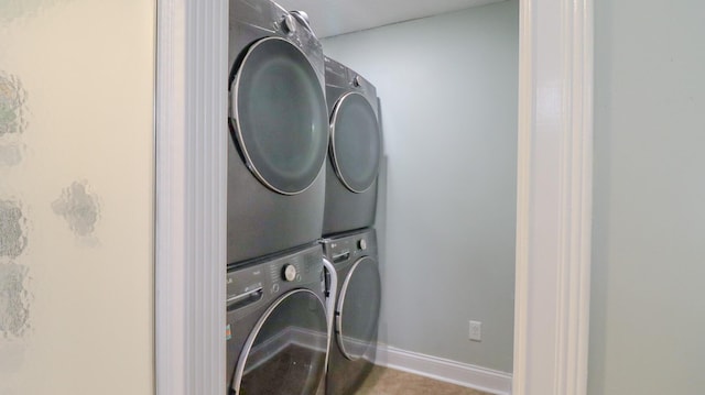 laundry area with stacked washing maching and dryer