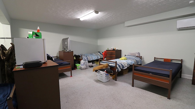 bedroom with a textured ceiling and a wall mounted AC