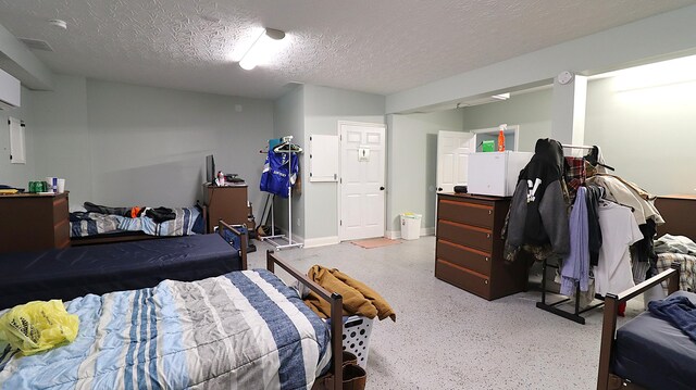 bedroom featuring a textured ceiling