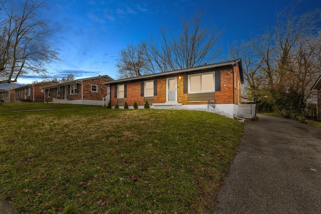 ranch-style house with a front lawn