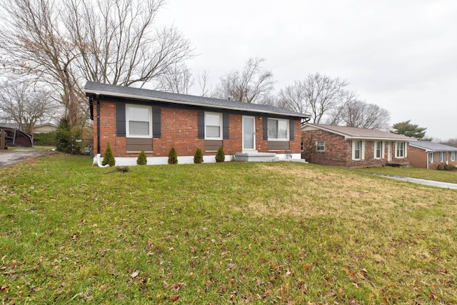 single story home with a front yard