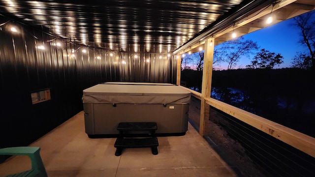 patio terrace at dusk with a hot tub