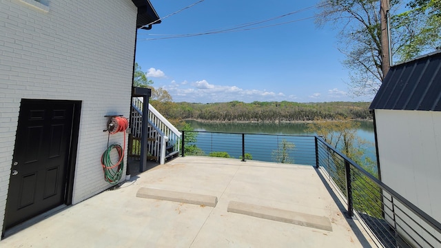 view of patio featuring a water view