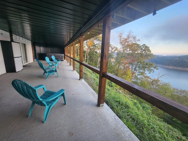 view of patio featuring a water view