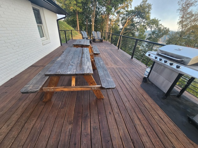 wooden terrace featuring grilling area