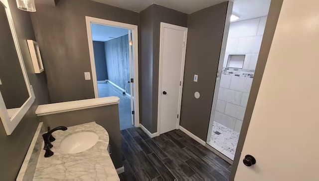 bathroom featuring vanity and walk in shower