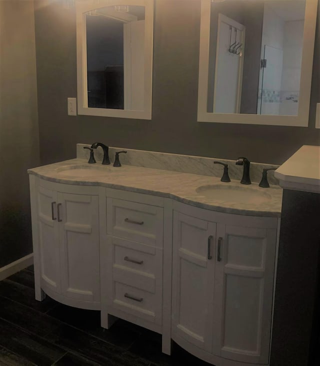 bathroom with tile patterned floors and vanity