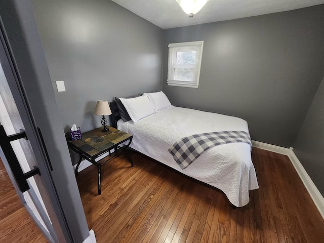 bedroom featuring dark wood-type flooring